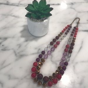 Boutique purple beaded statement necklace.
